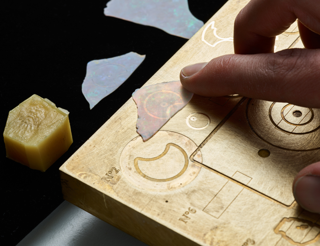 Lining_up_an_opal_slice_used_for_making_the_dial_of_the_Romain_Gauthier_Insight_Micro-Rotor_Lady_Opal