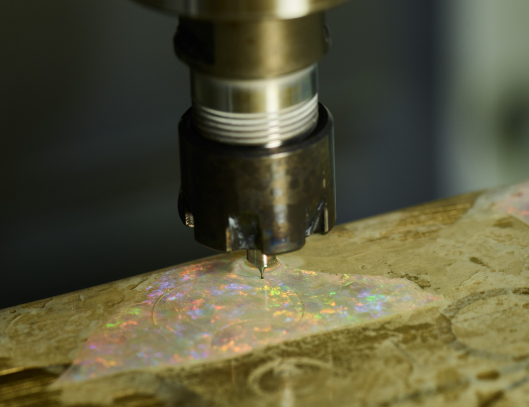 A_milling_tool_on_a_3-axe_machining_centre_is_used_to_cut_the_outline_of_the_hour-minute_subdial_small seconds_and_mainplate_cover_on_opal_slices_for_the_Romain_Gauthier_Insight_Micro-Rotor_Lady_Opal