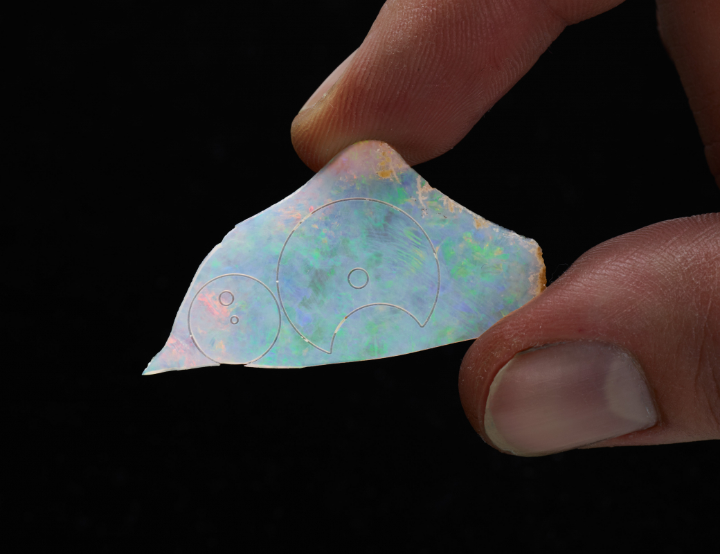 The_outline_of_the_hour-minute_subdial_and_small seconds_of_the_Romain_Gauthier_Insight_Micro-Rotor_Lady_Opal_cut_on_an_opal_slice.jpg