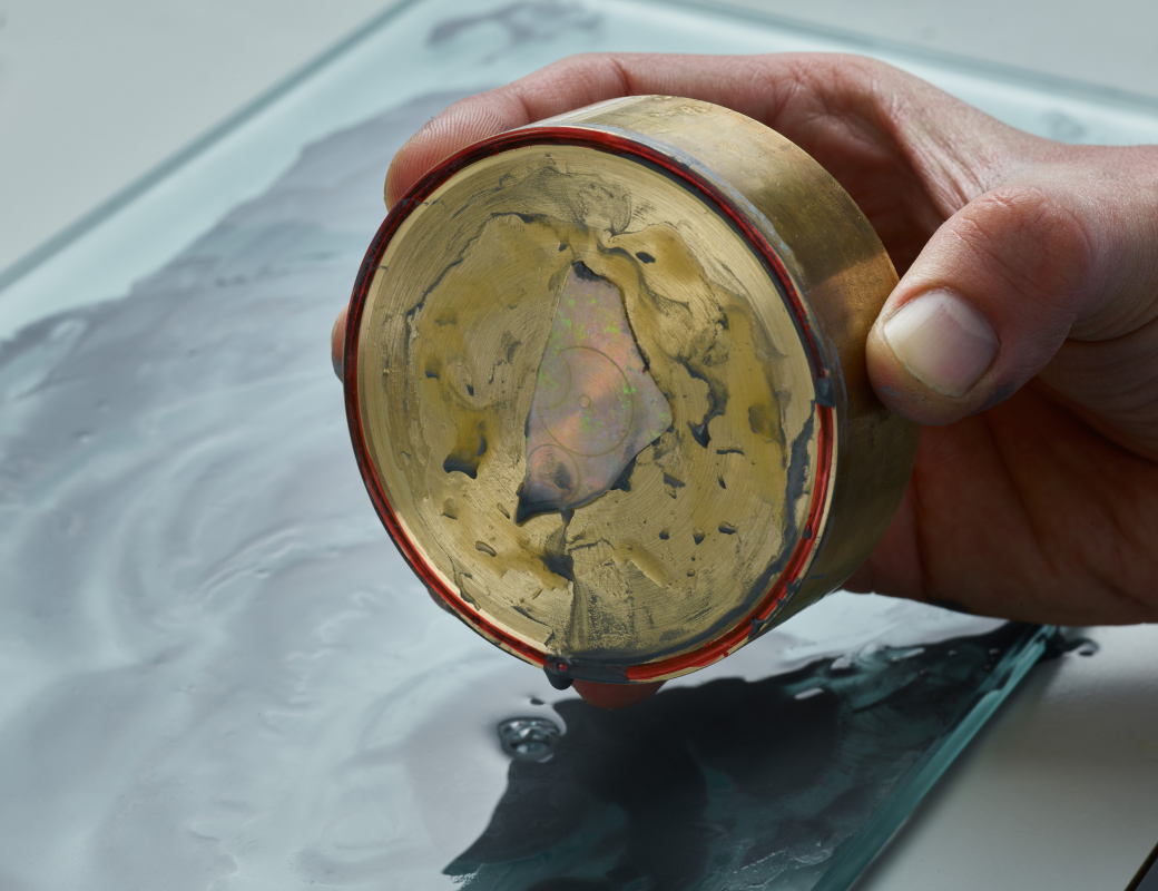 Rubbing_the_opal_by_hand_on_a_glass_board_covered_with_a_mixture_of_diamond_powder_and_water_to make_the_opal_the_right_thickness_for_the_Romain_Gauthier_Insight_Micro-Rotor_Lady_Opal